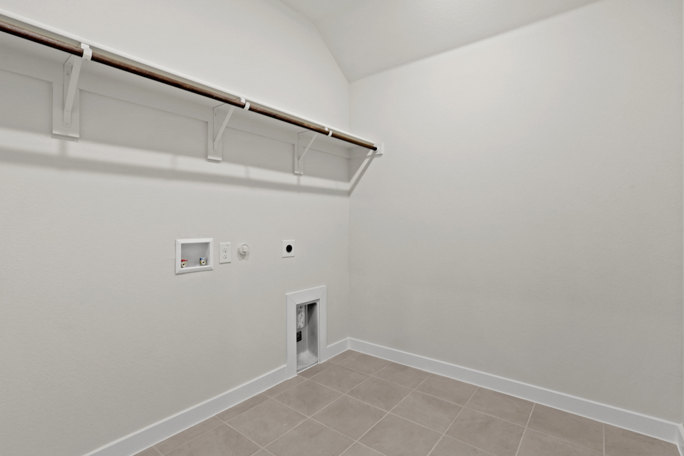 A white wall with a vent.
