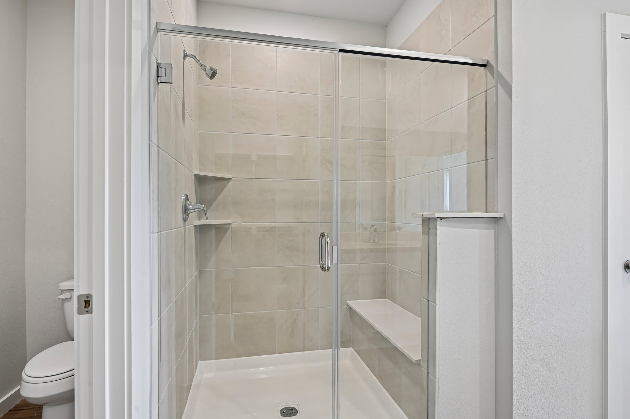 A bathroom with a glass shower.