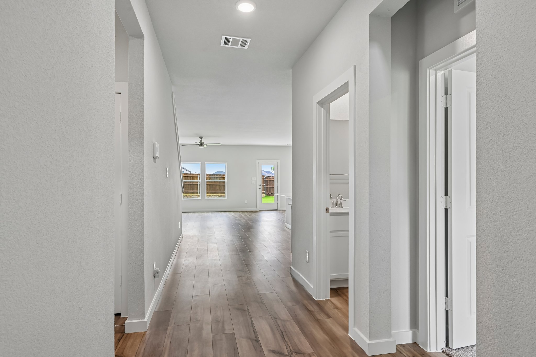 A hallway with white walls.