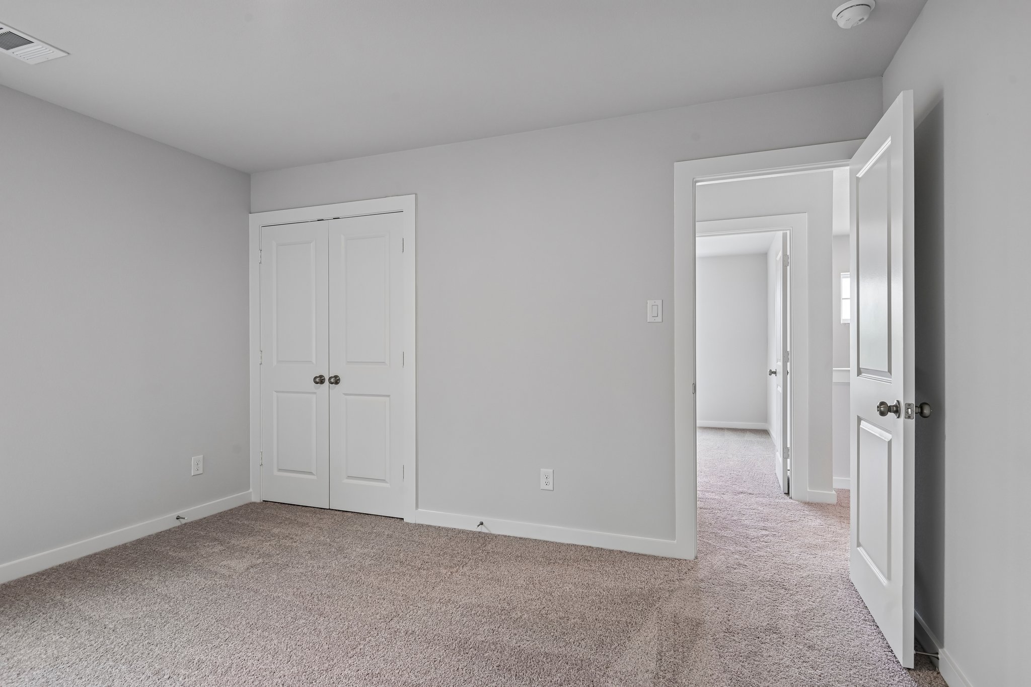 A room with white doors.