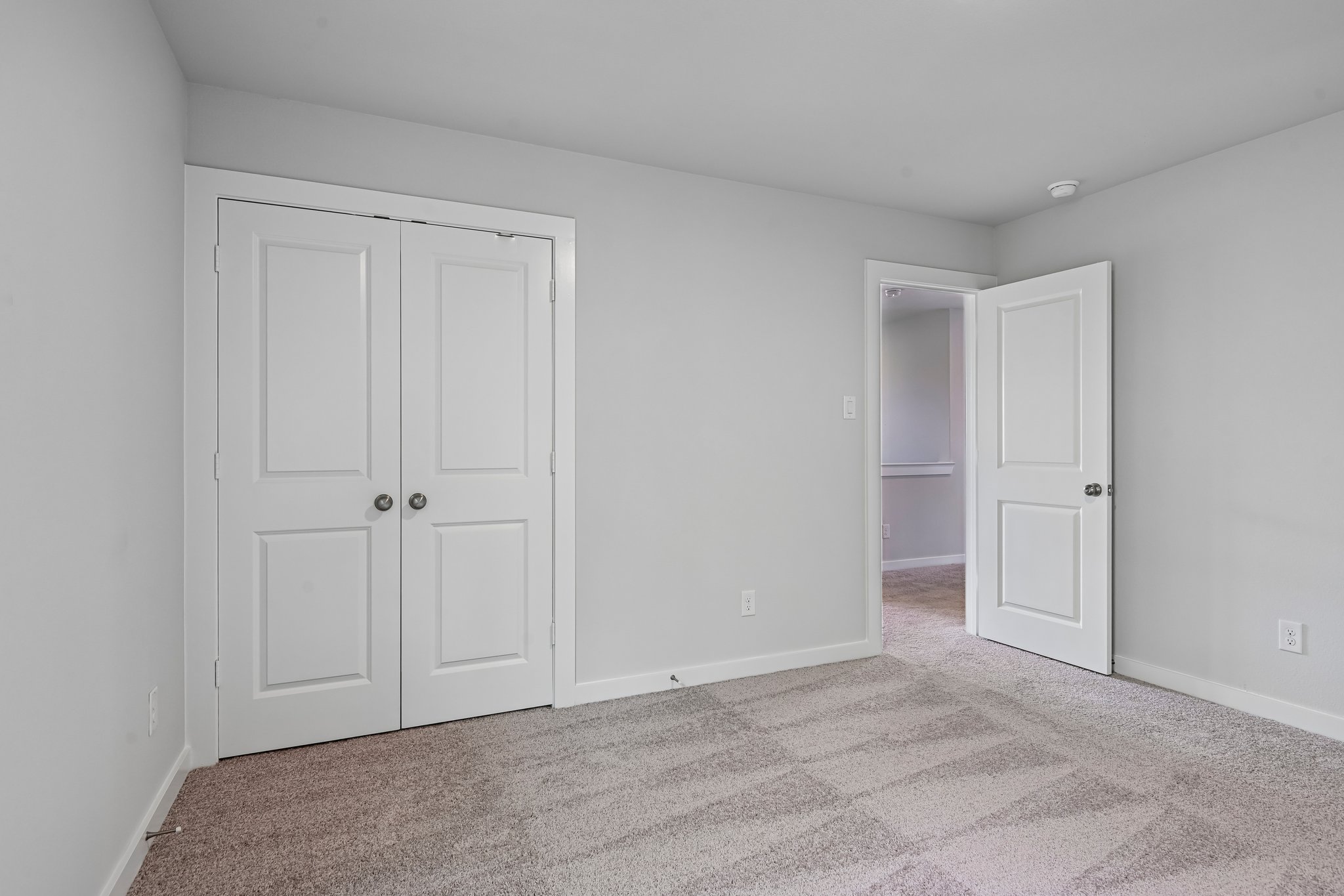 A room with white doors.
