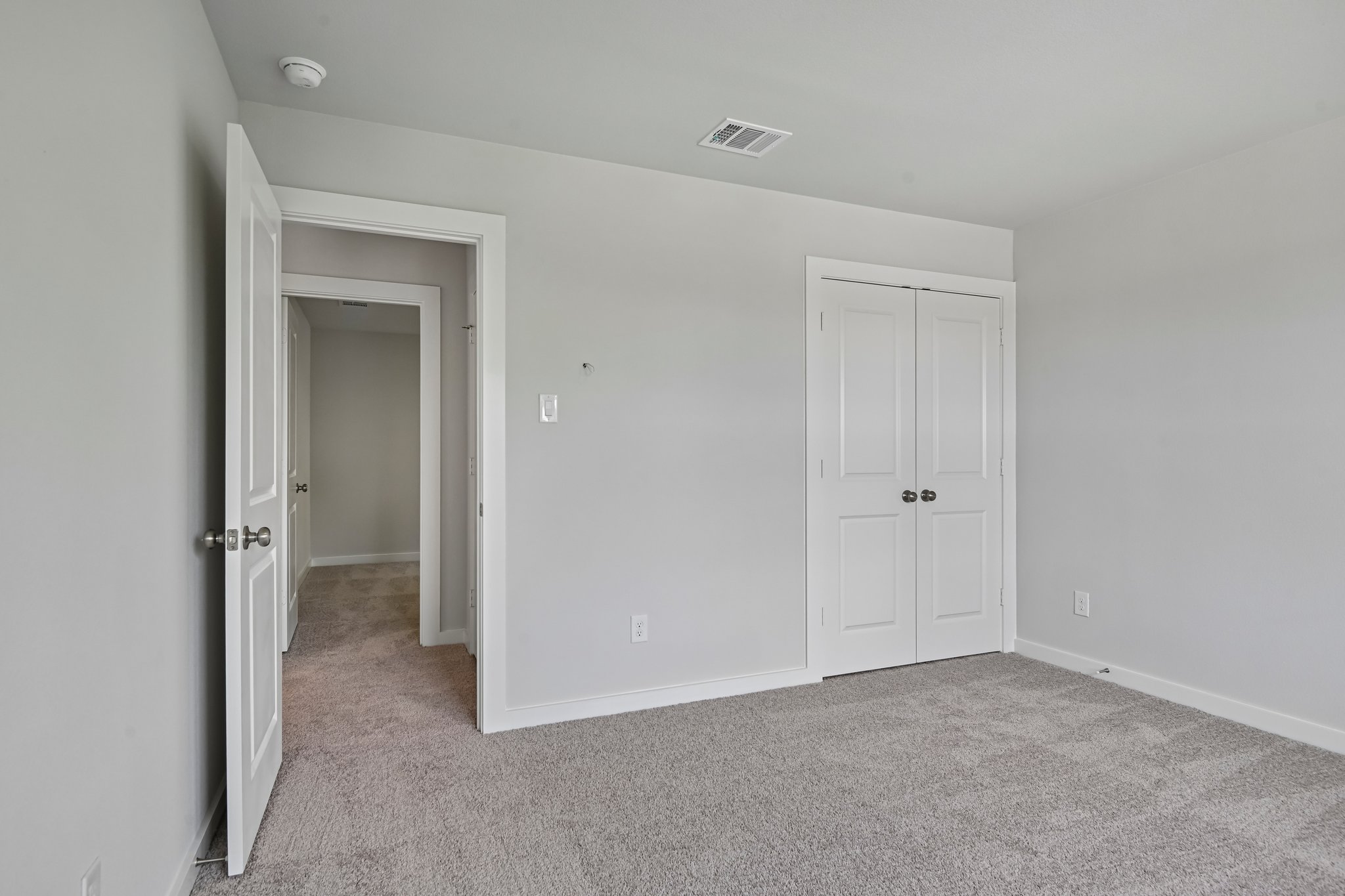 A room with white doors.