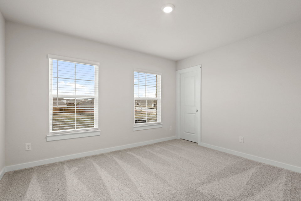 A room with windows and a door.