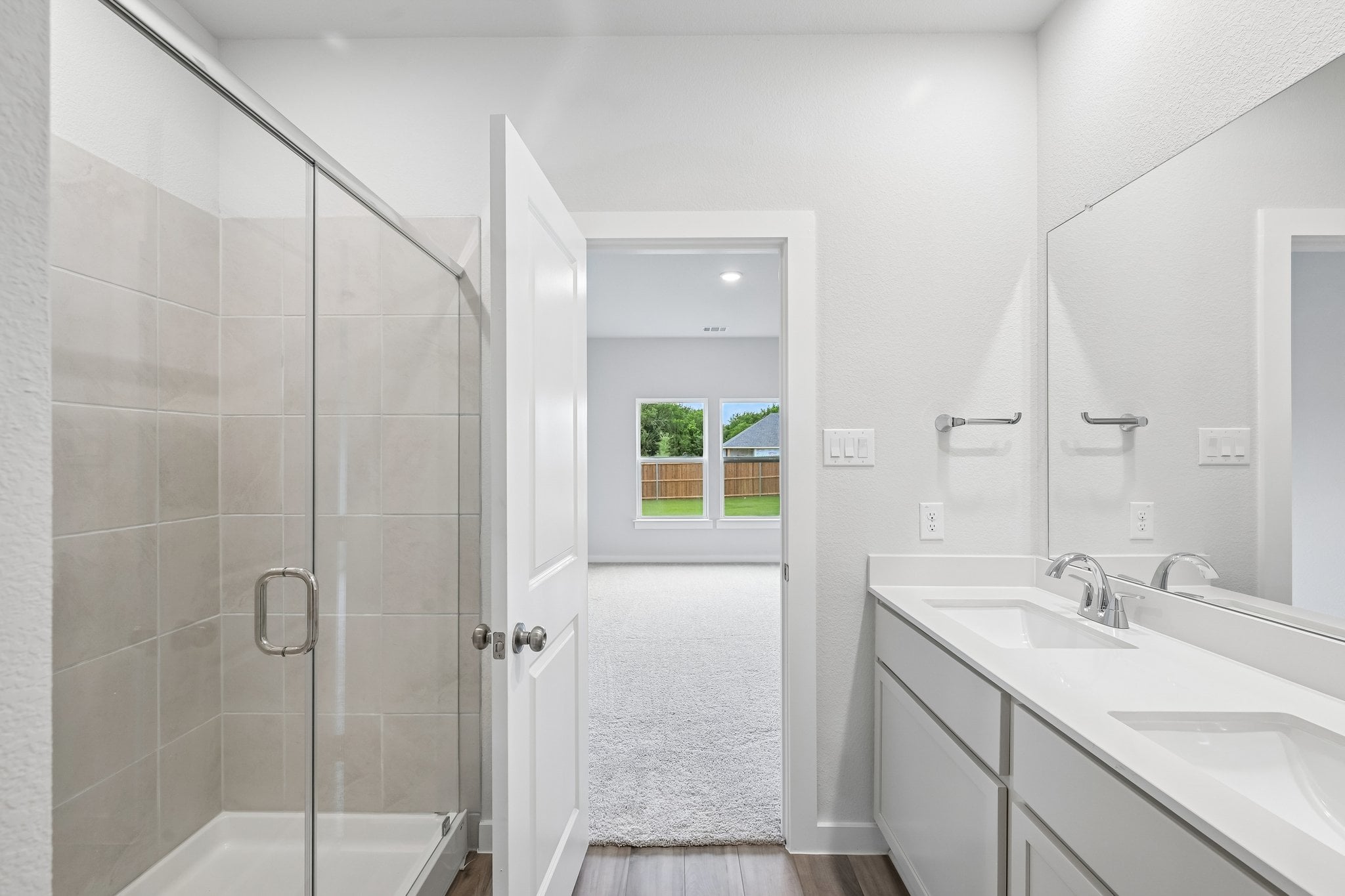 A bathroom with a glass shower.