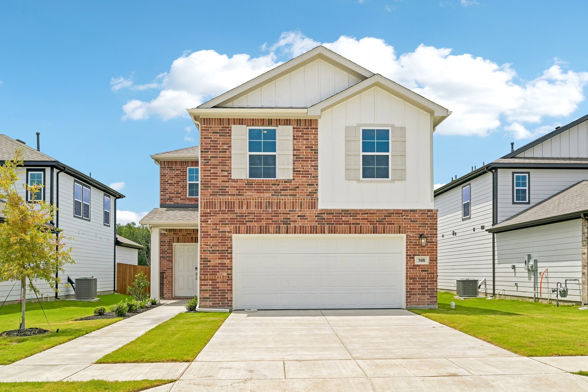 A brick building with a garage.