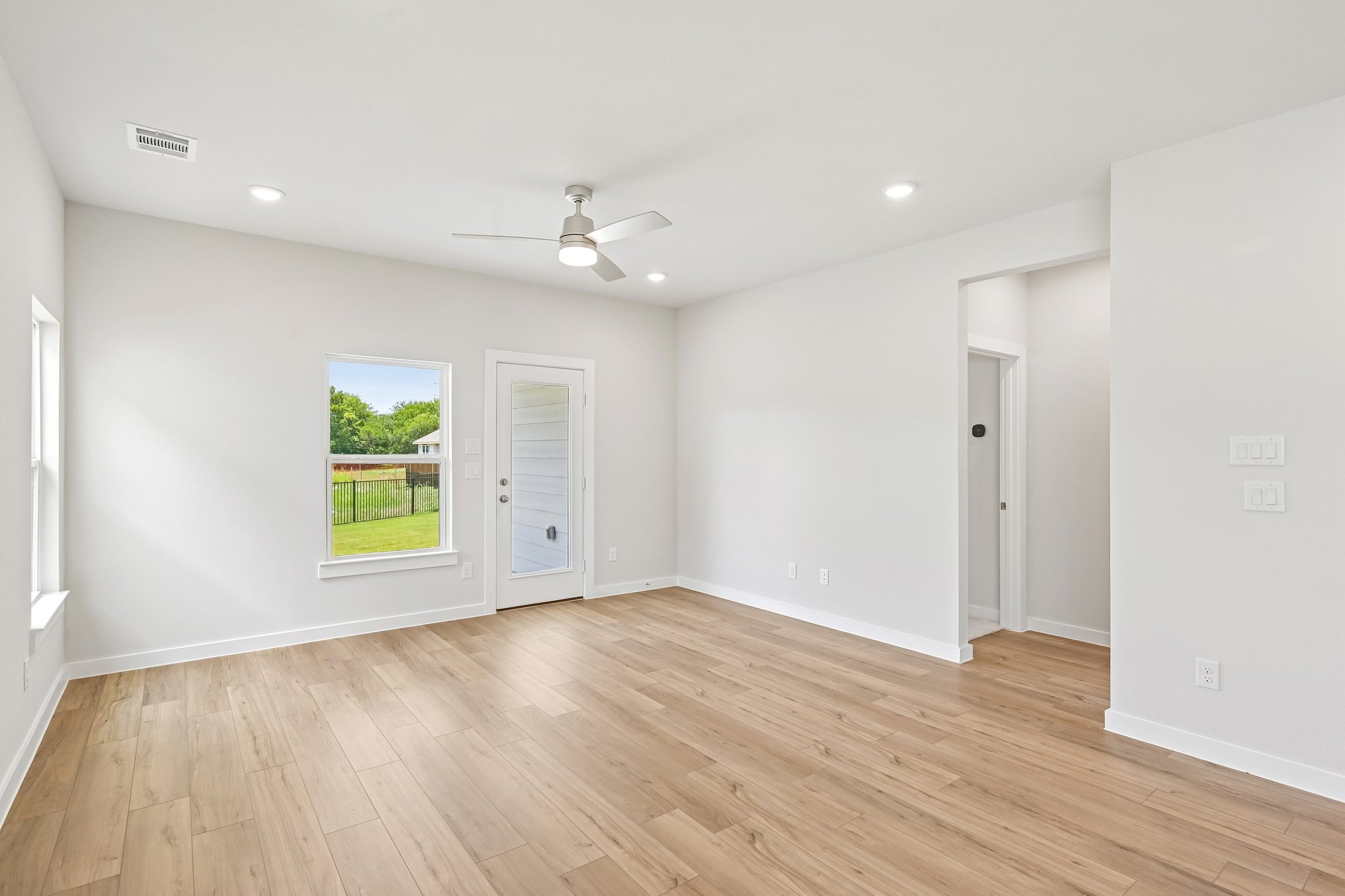 A room with a wood floor and a wood floor with a wood floor.