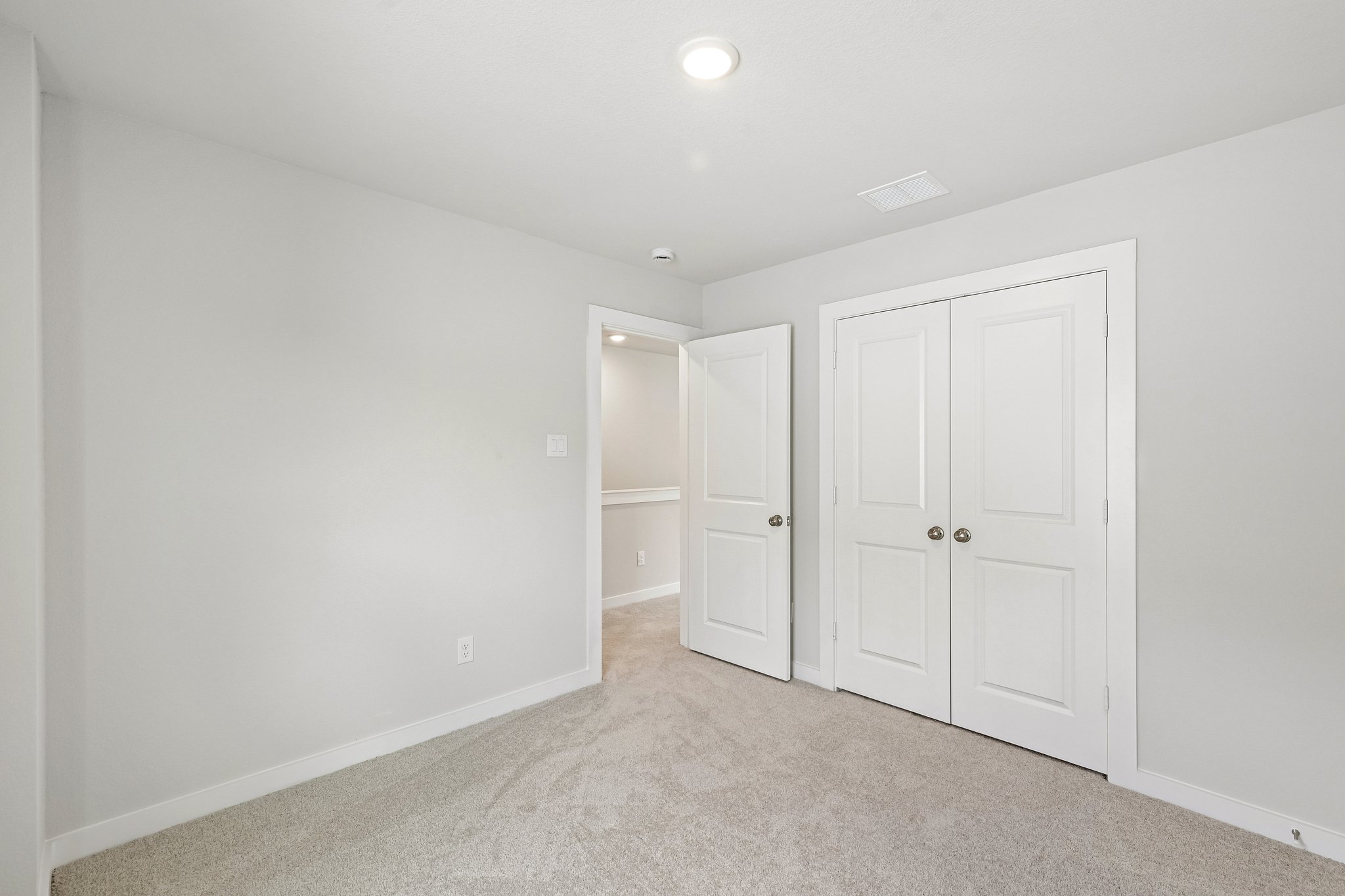 A room with white doors.