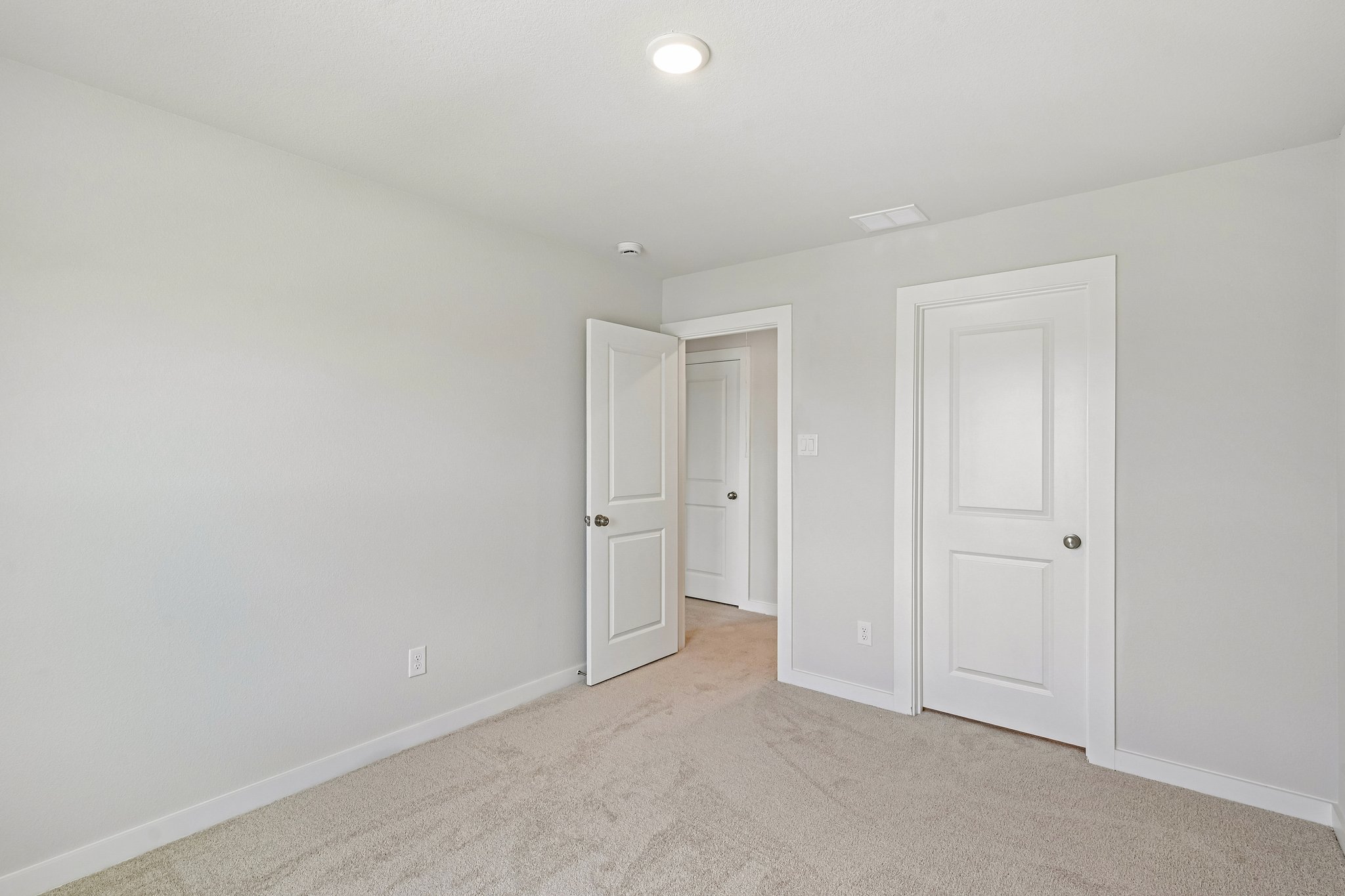A room with white doors.