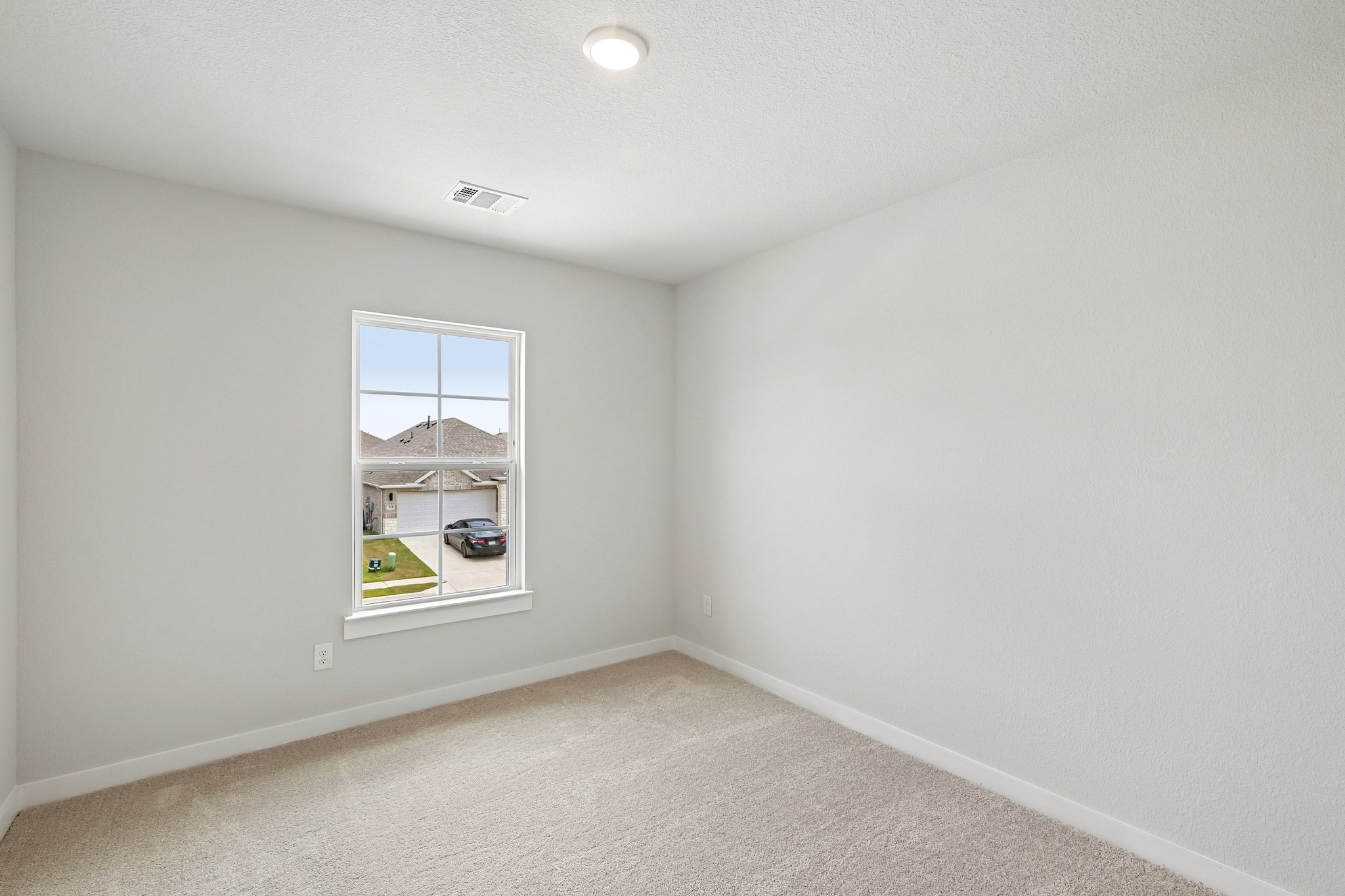A room with a window and a light.