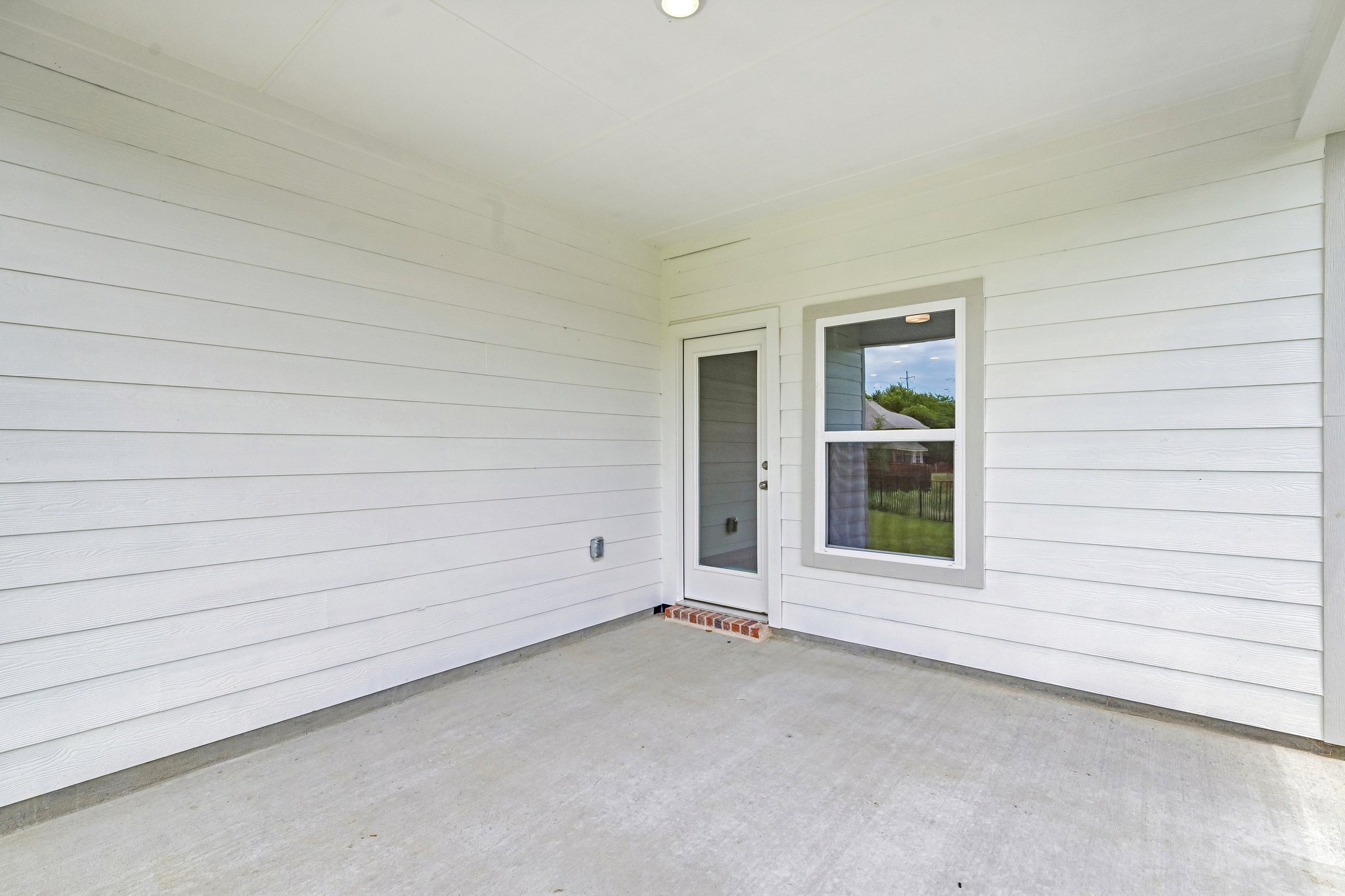 A white room with a window.