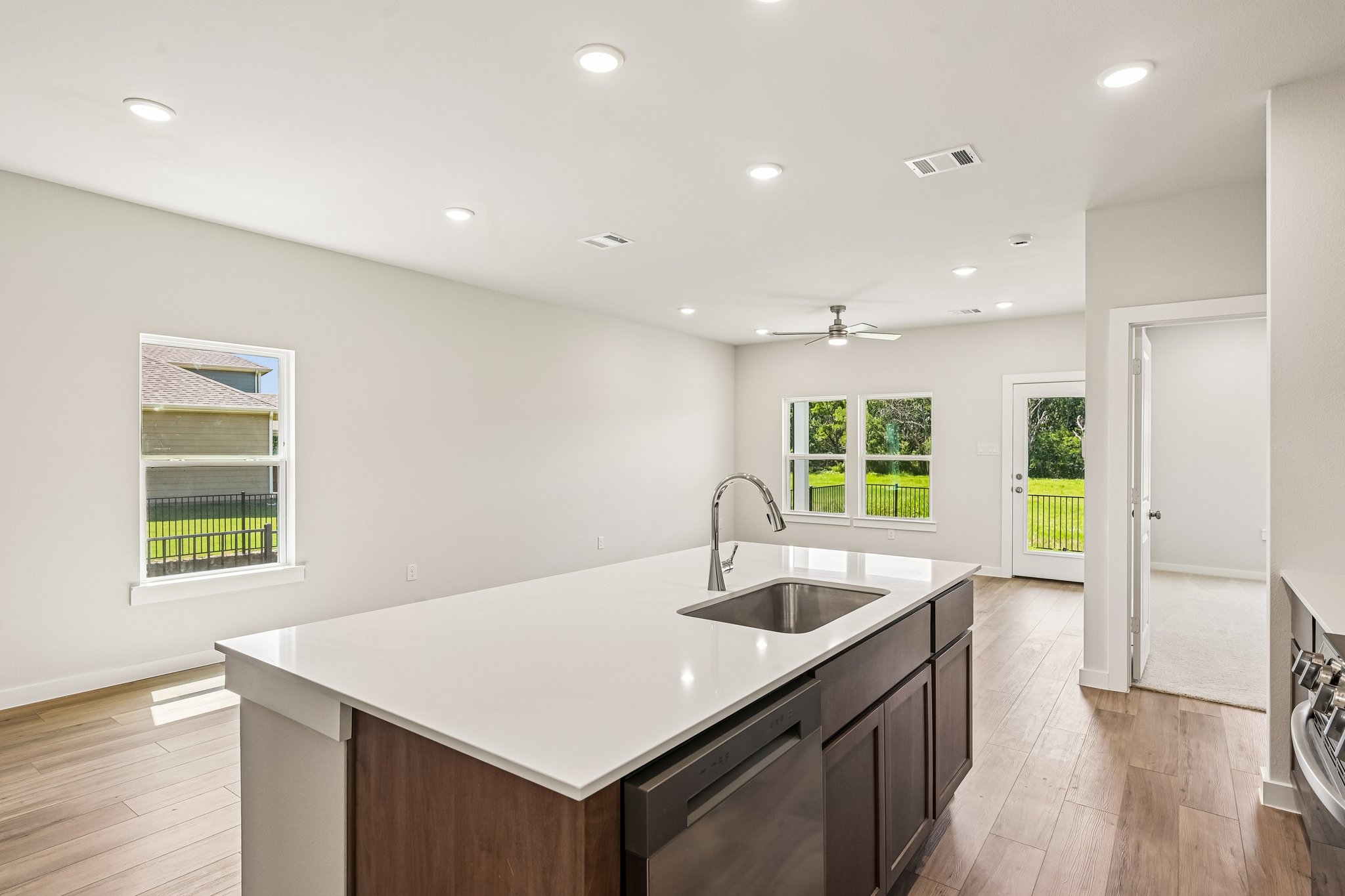 A kitchen with a sink and a counter top.
