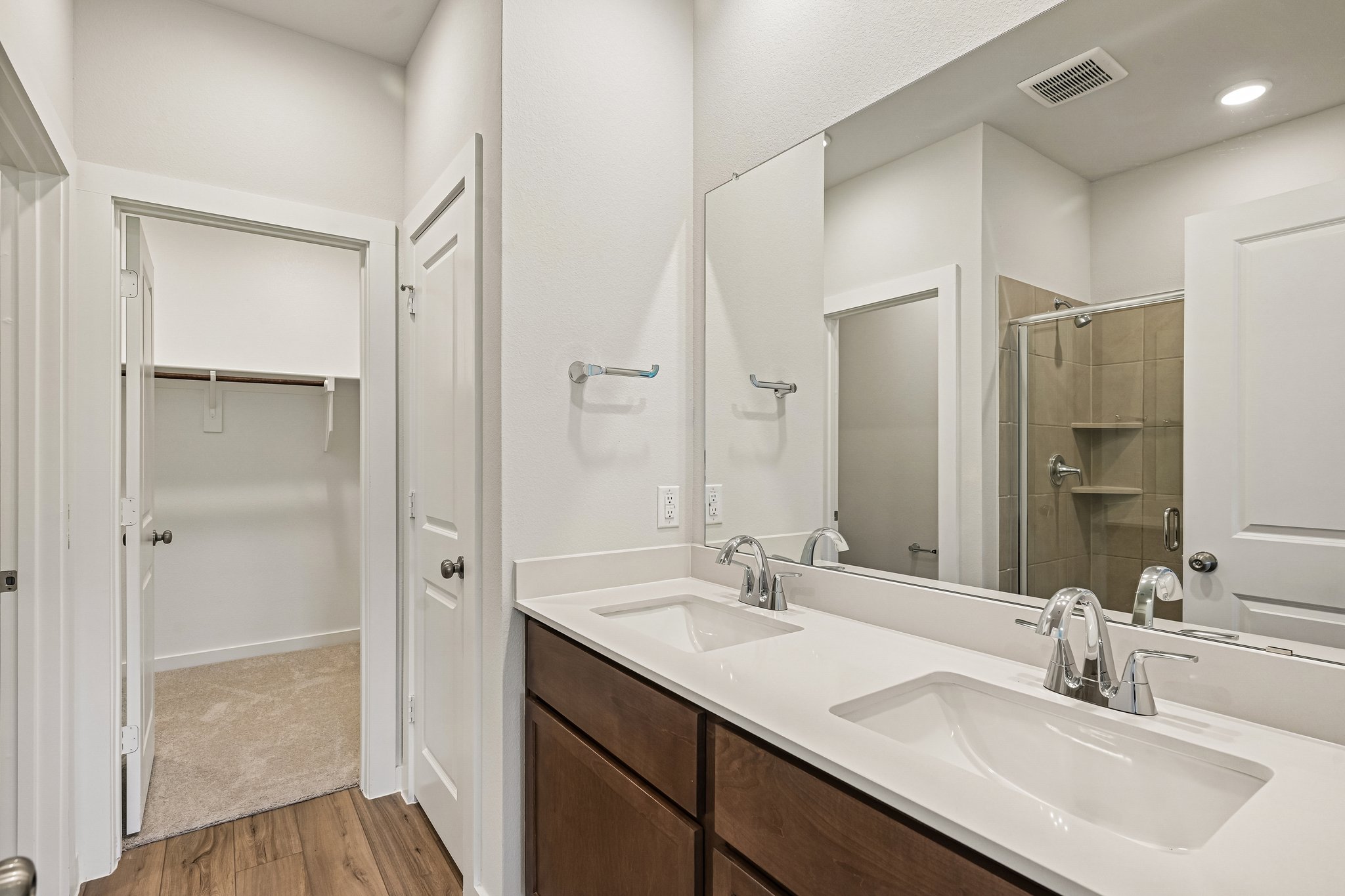 A bathroom with two sinks.