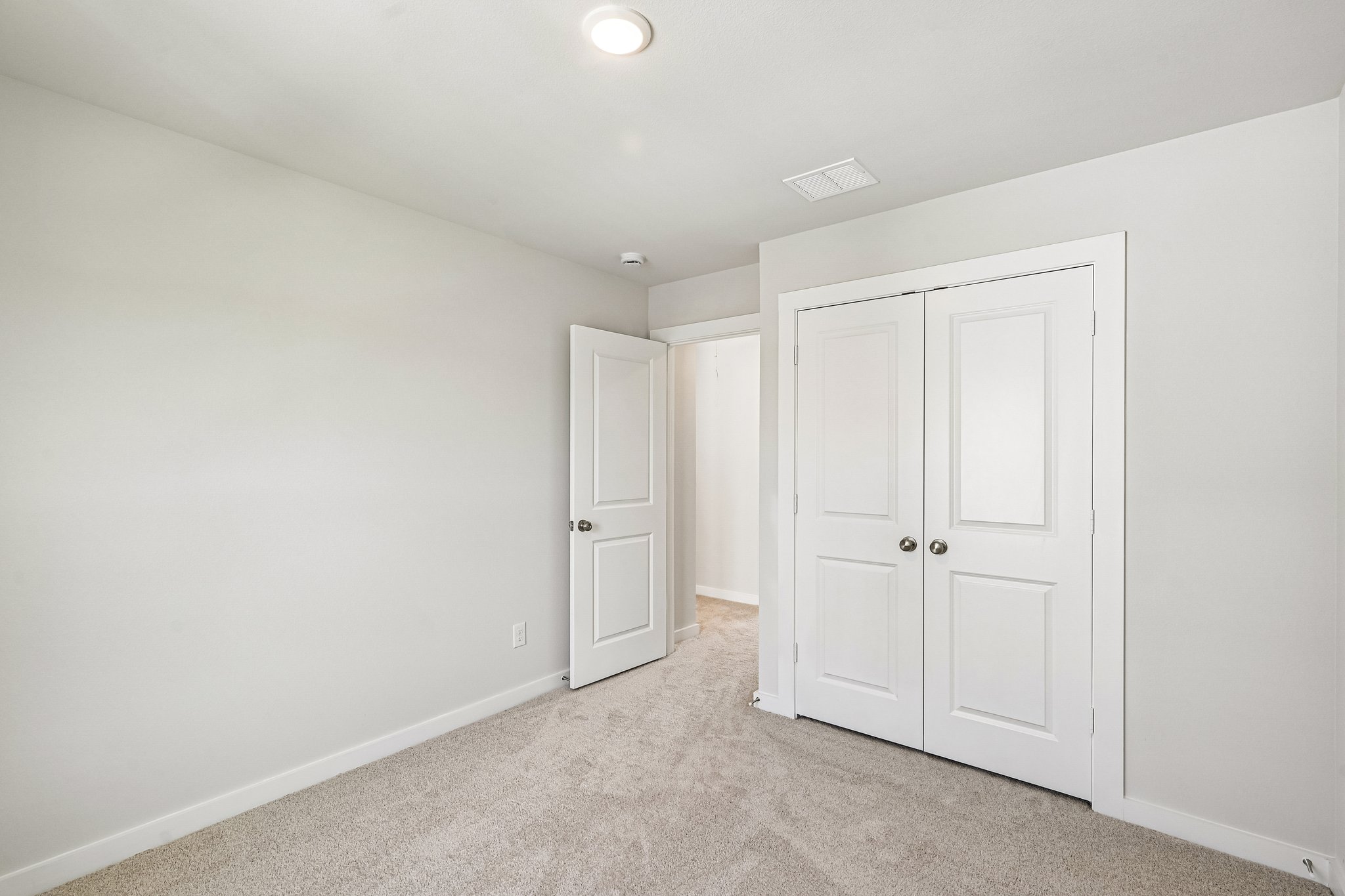 A room with white doors.