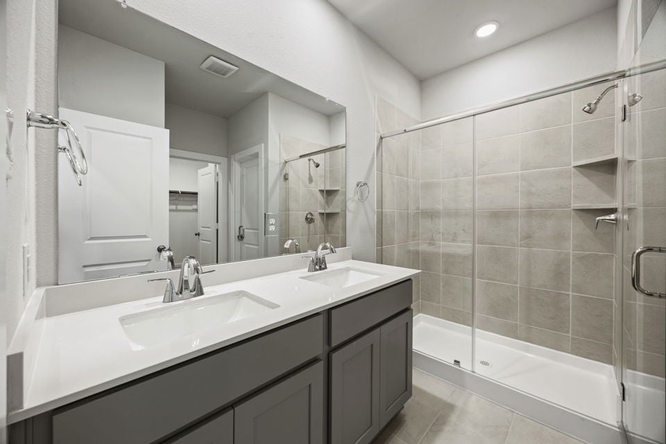 A bathroom with a glass shower.