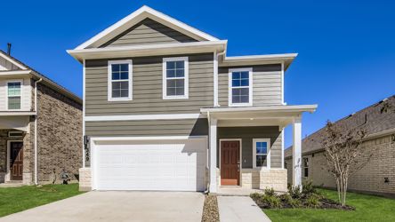 A white house with a garage.