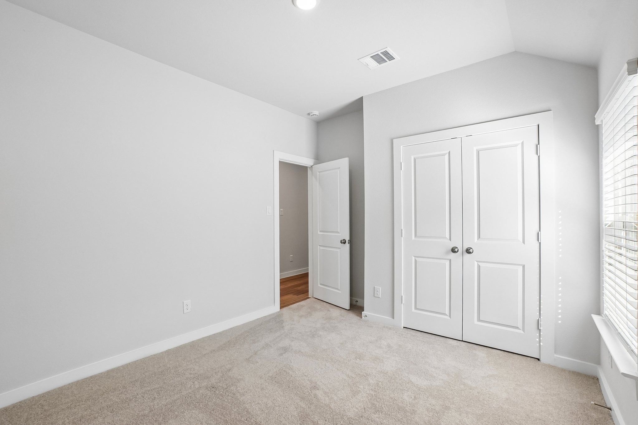 A room with white doors.