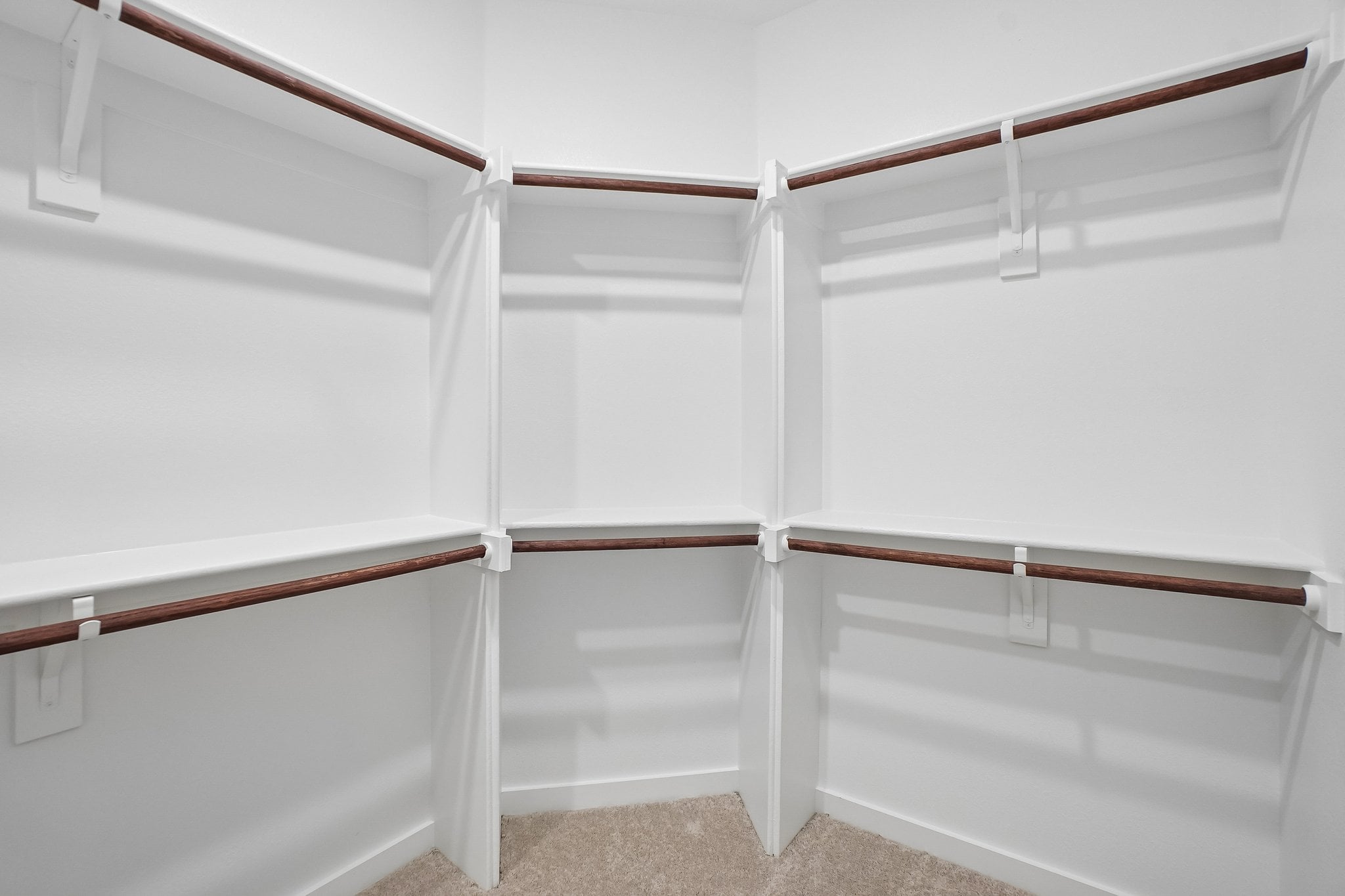 A white staircase with white walls.