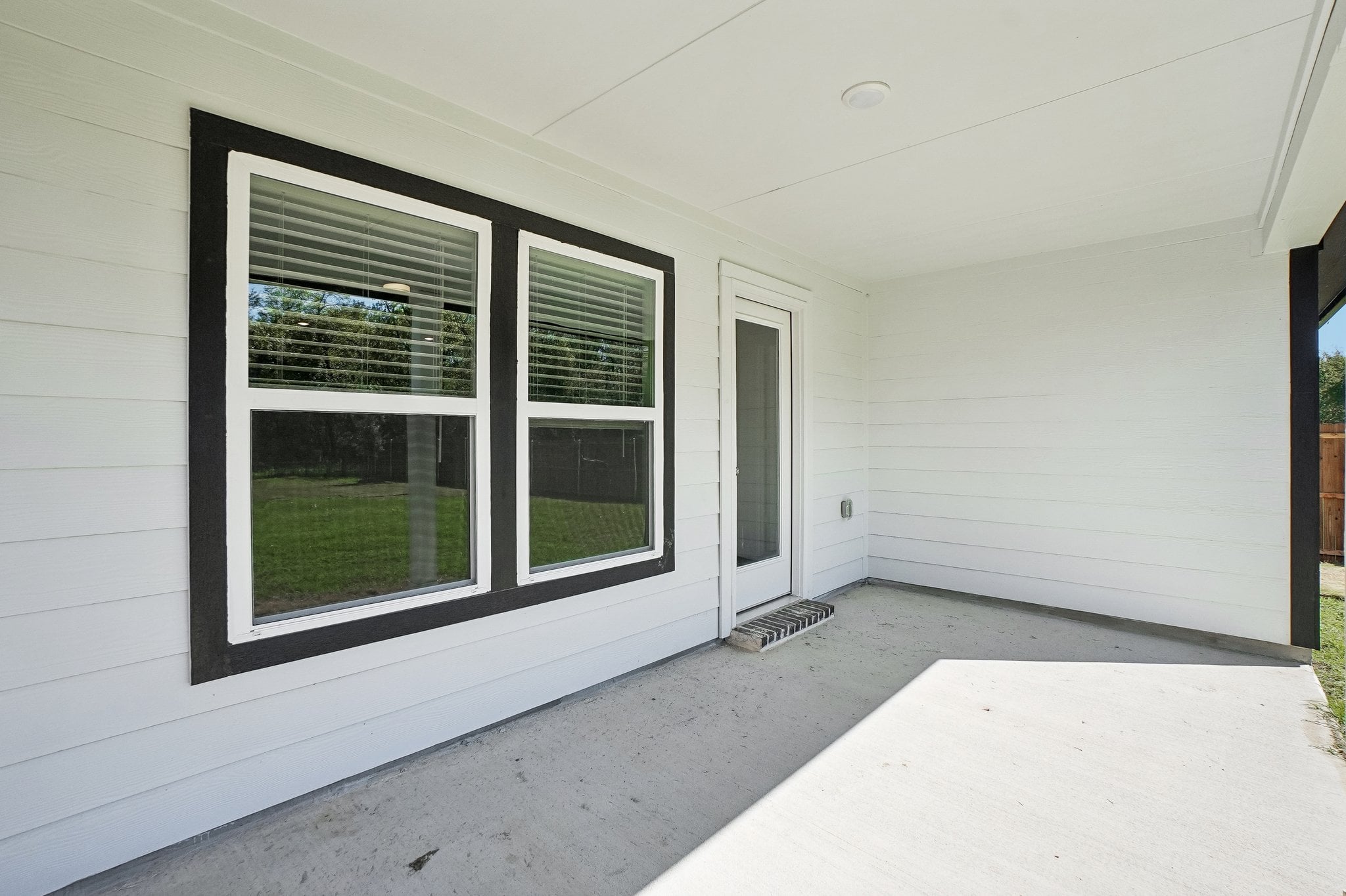 A white house with a window.