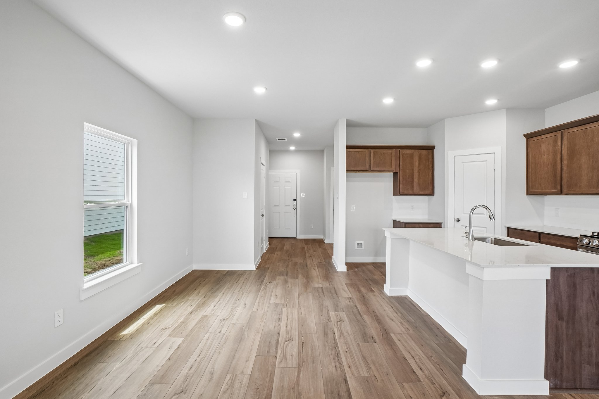 A kitchen with wooden floors.