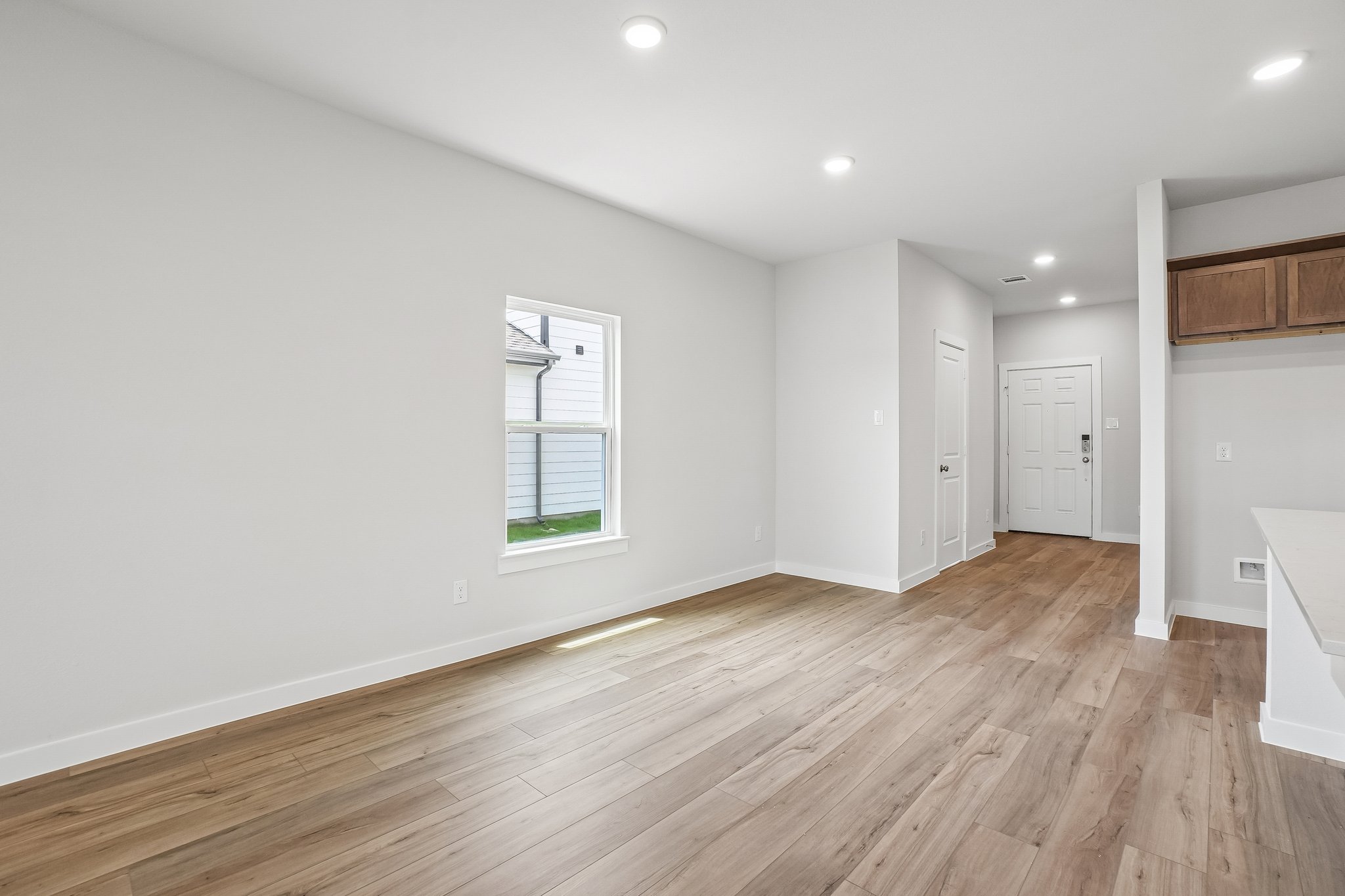 A room with a wood floor and a wood floor.