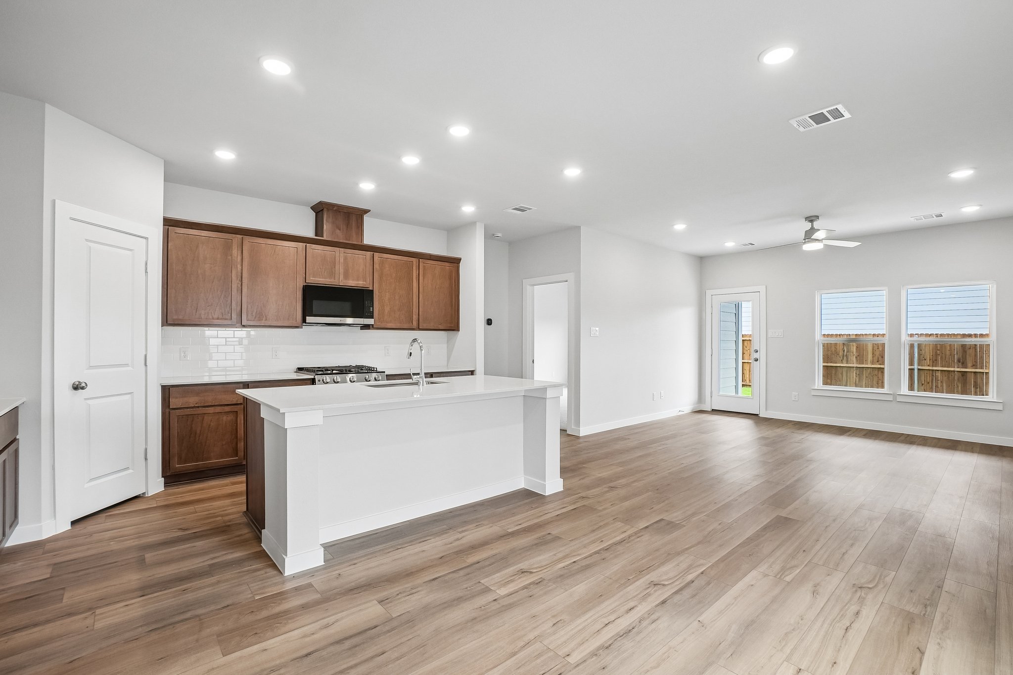A large kitchen with wooden cabinets.