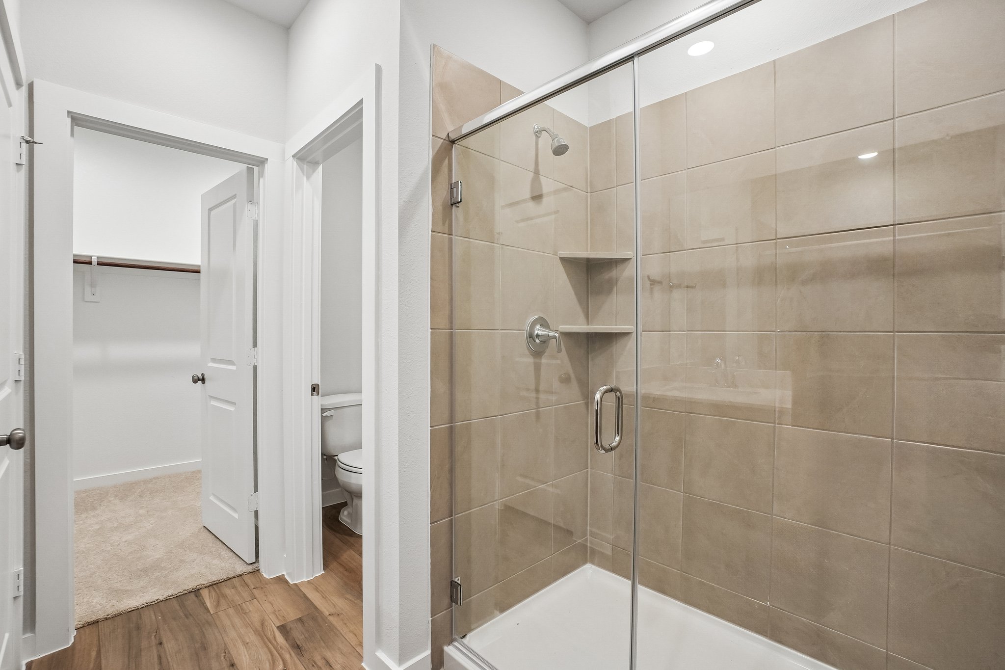 A bathroom with a glass shower.