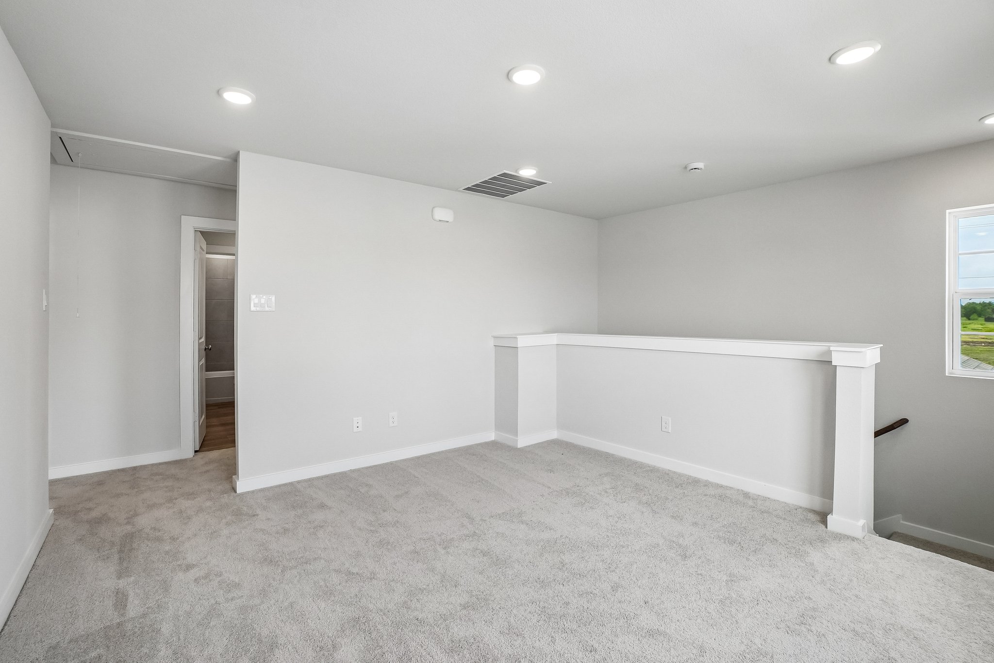 A room with a white table and a white wall.