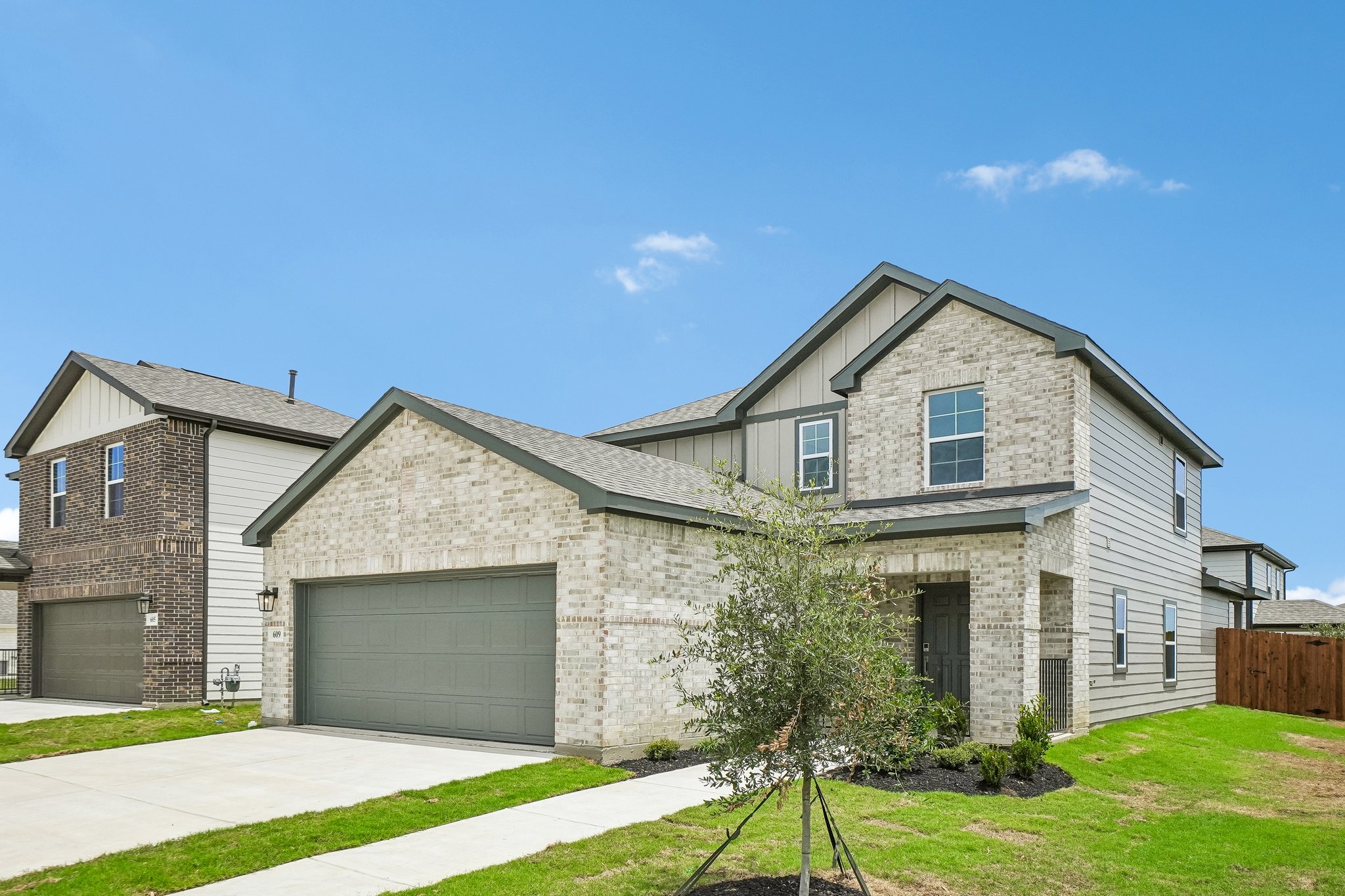 A large house with a driveway.
