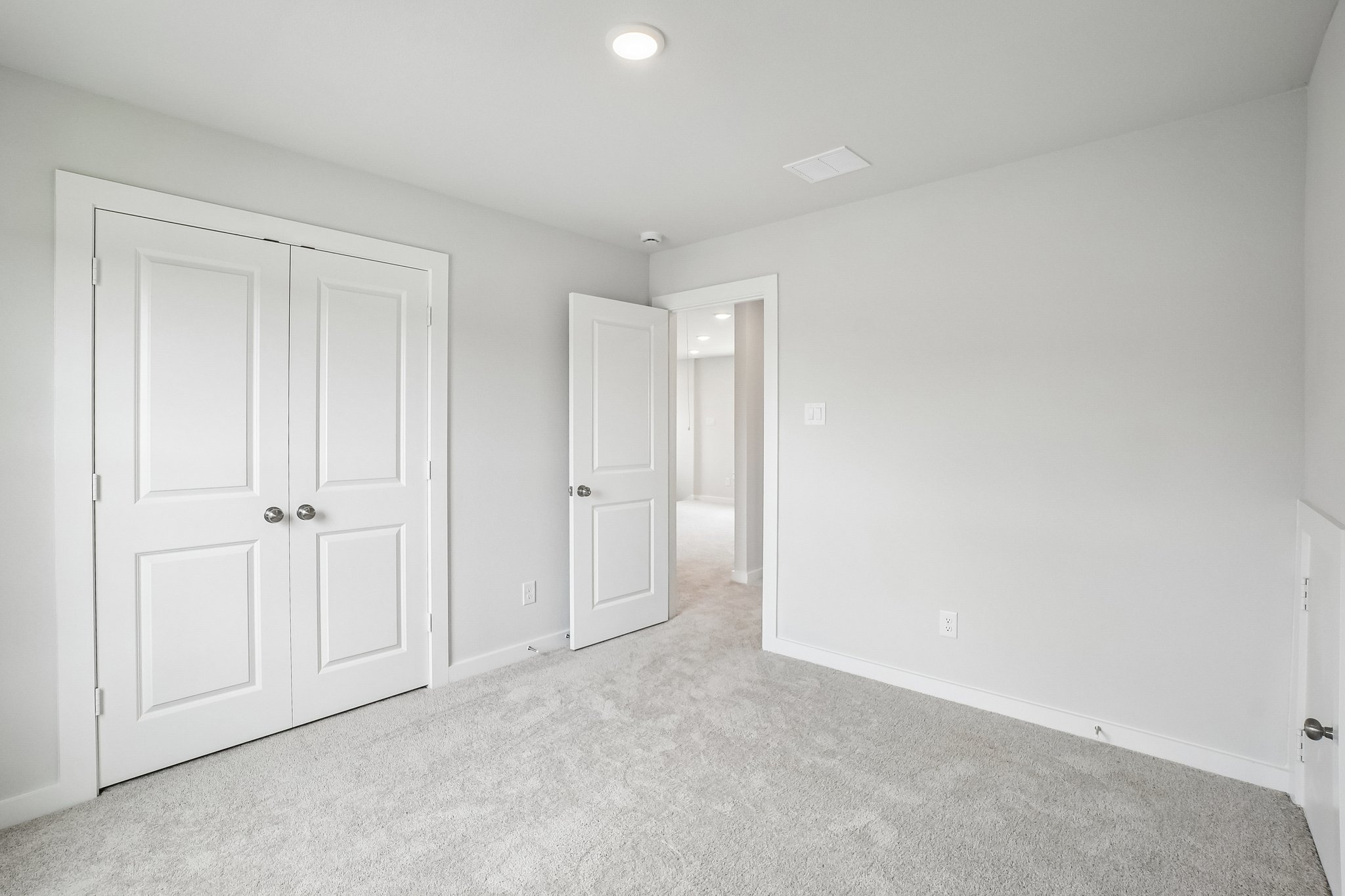A room with white doors.