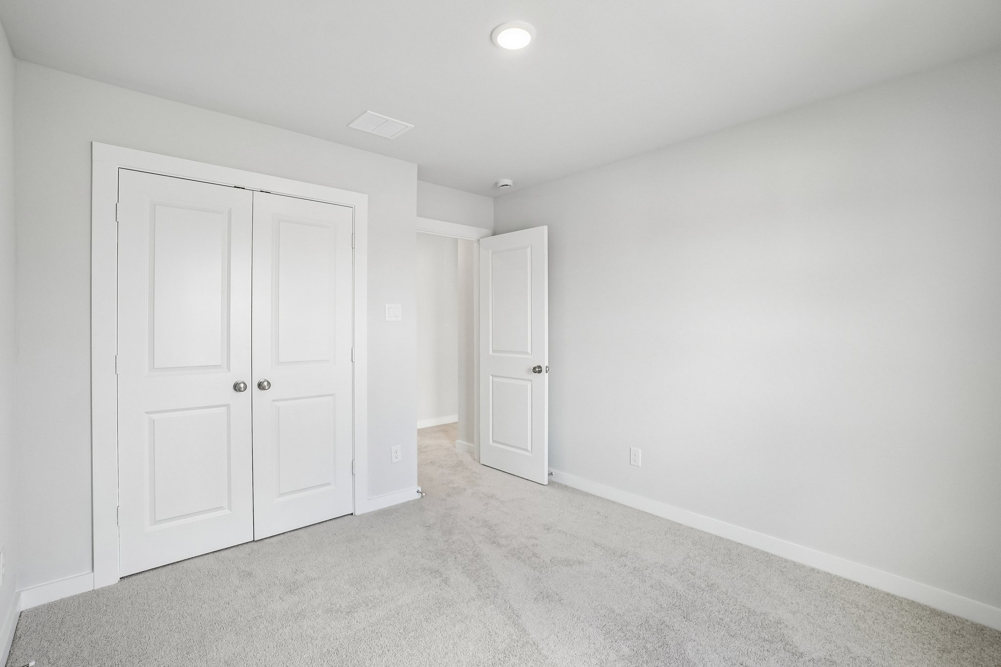 A room with white doors.