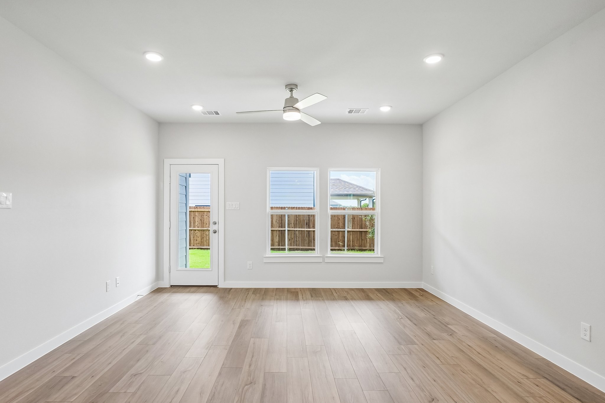 A room with a wood floor and a wood floor with a wood floor.