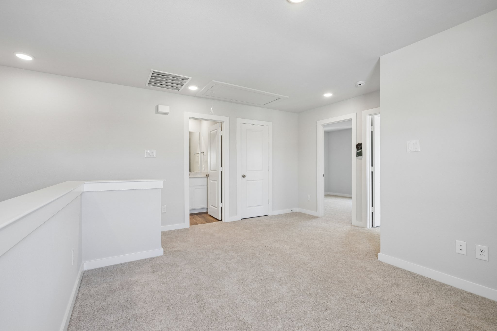 A room with white cabinets.