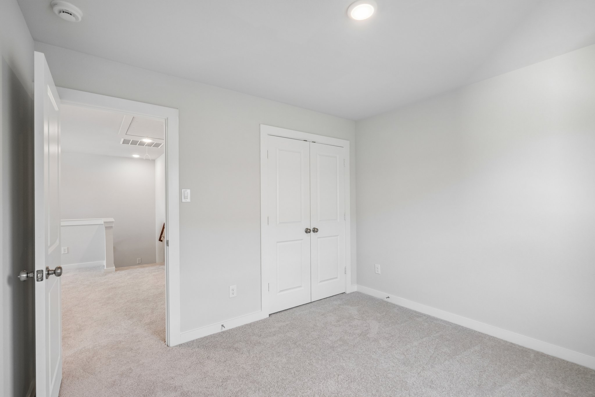 A room with white doors.
