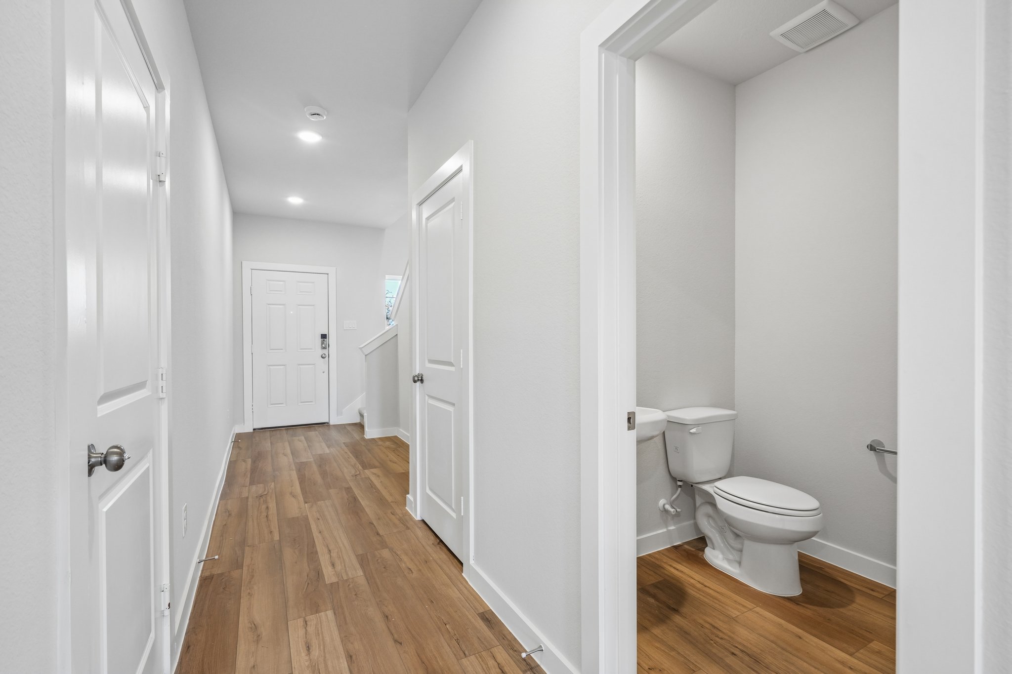 A bathroom with white walls.