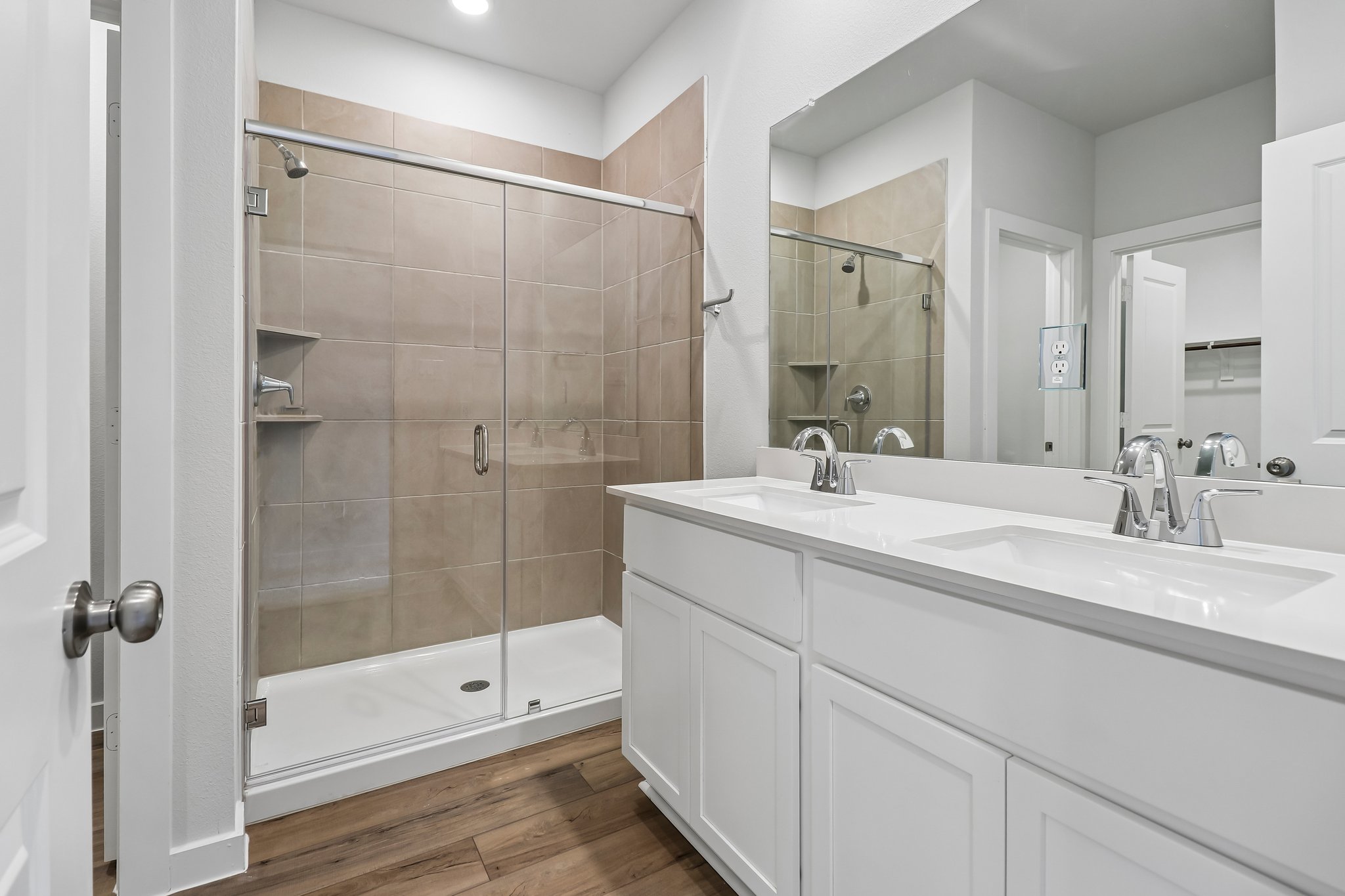 A bathroom with a glass shower.