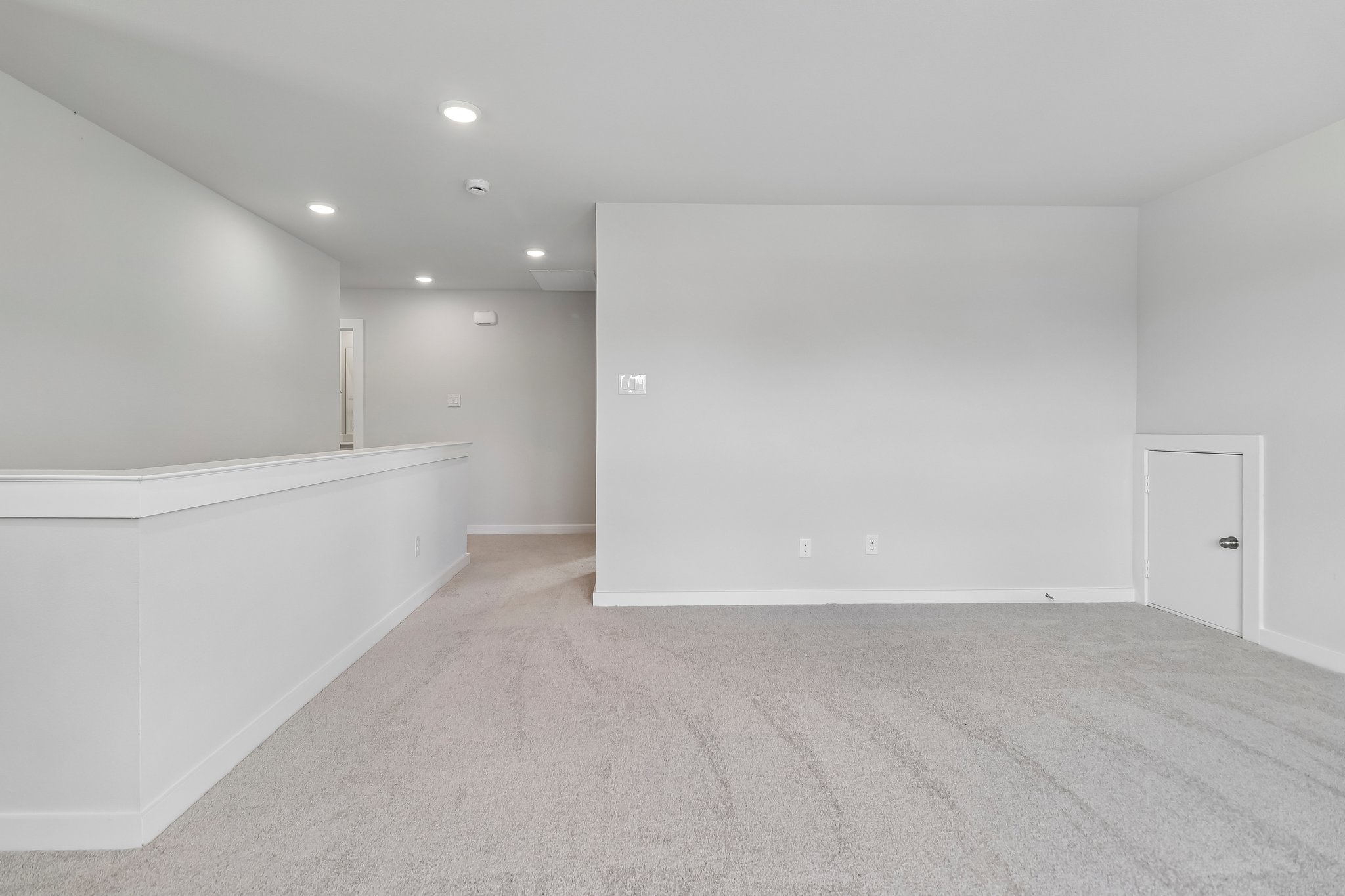 A room with a white wall and a white floor.