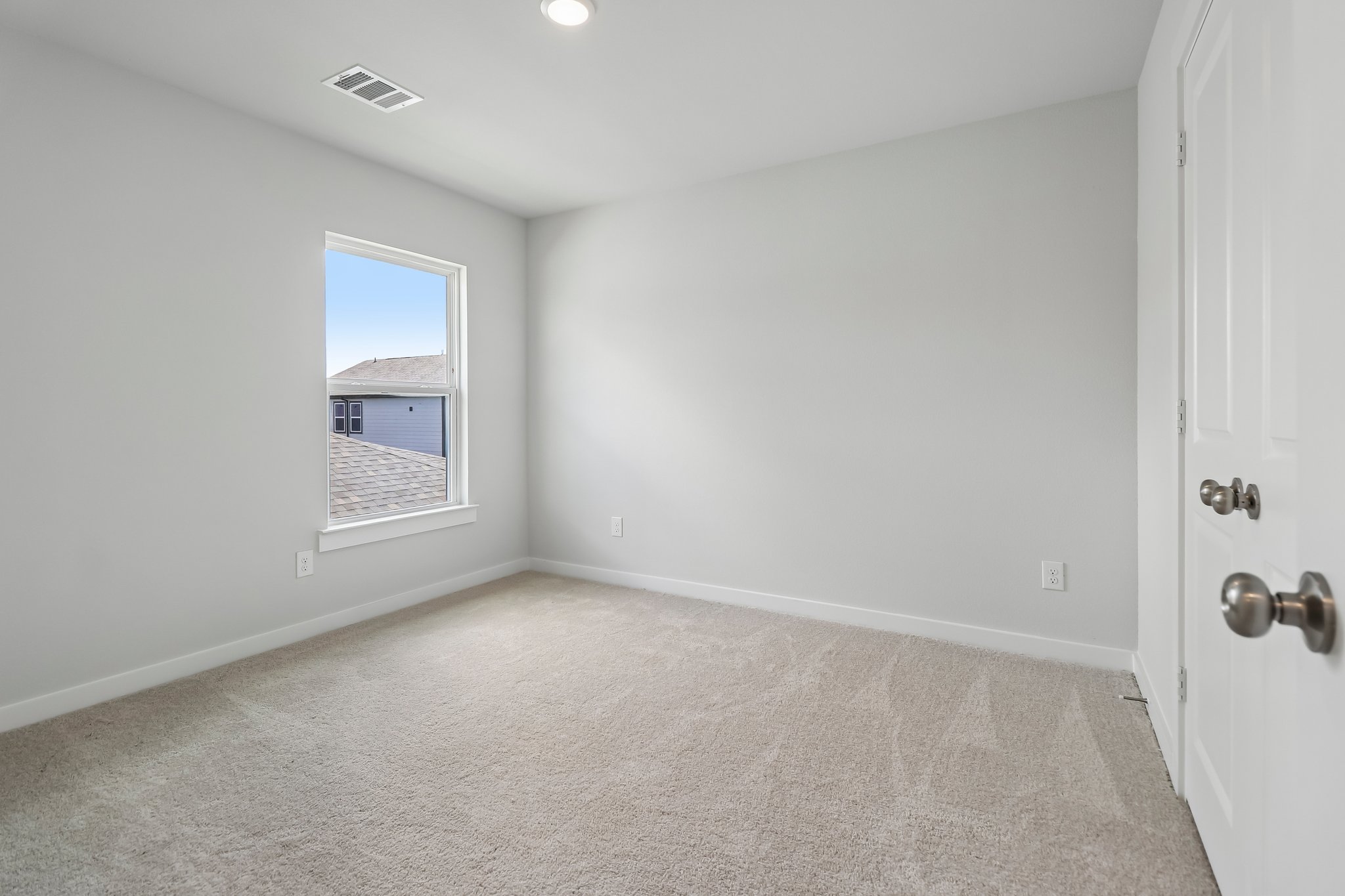 A room with a door and a window.