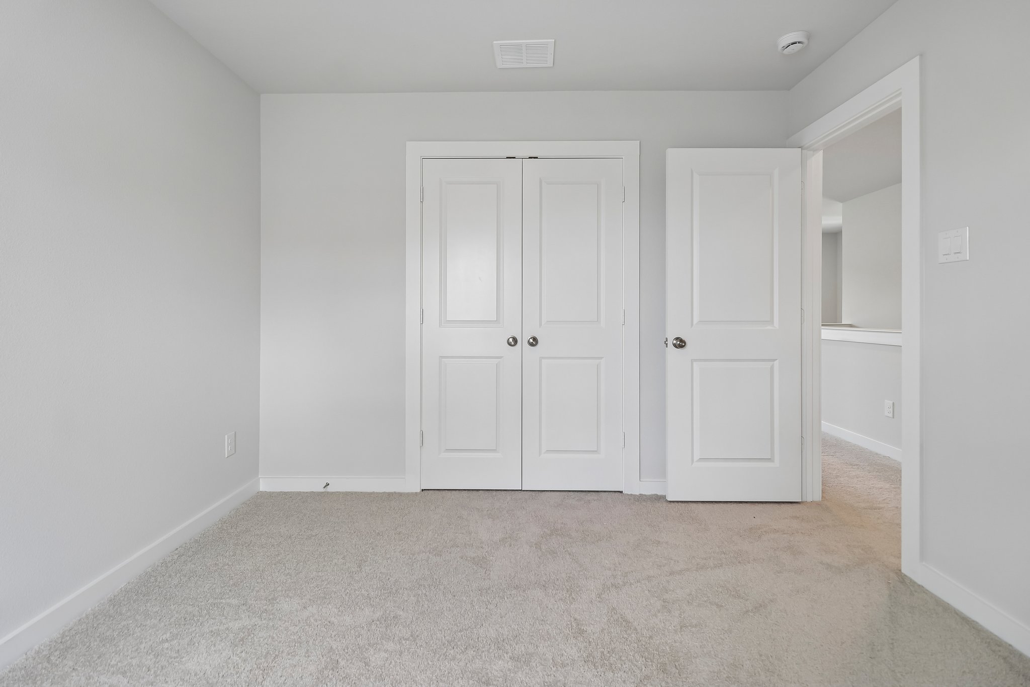 A room with white doors.