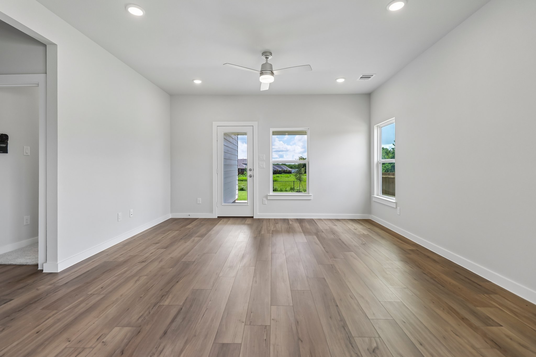 A room with a wood floor and a wood floor.
