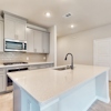 Kitchen Island  of 263 Fire Rock at Ambergrove by Century Communities