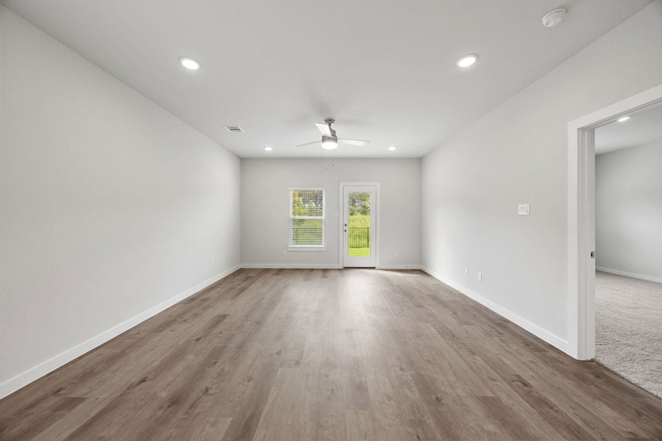 A room with a wood floor and a wood floor.