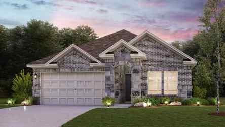 A house with a garage and a lawn in front of it.