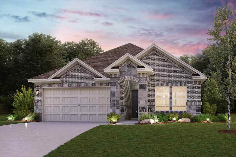 A house with a garage and a lawn in front of it.