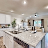 Kitchen island at 204 Sun Harvest Drive at Ambergrove by Century Communities