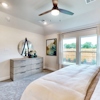 Primary bedroom at 204 Sun Harvest Drive at Ambergrove by Century Communities