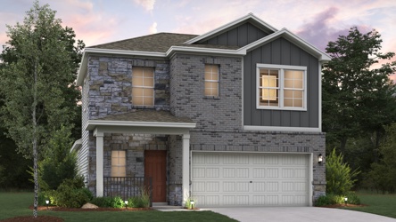 A house with a garage and trees.