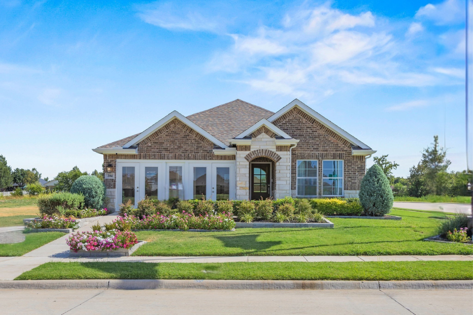 A large house with a lawn and a large front yard.