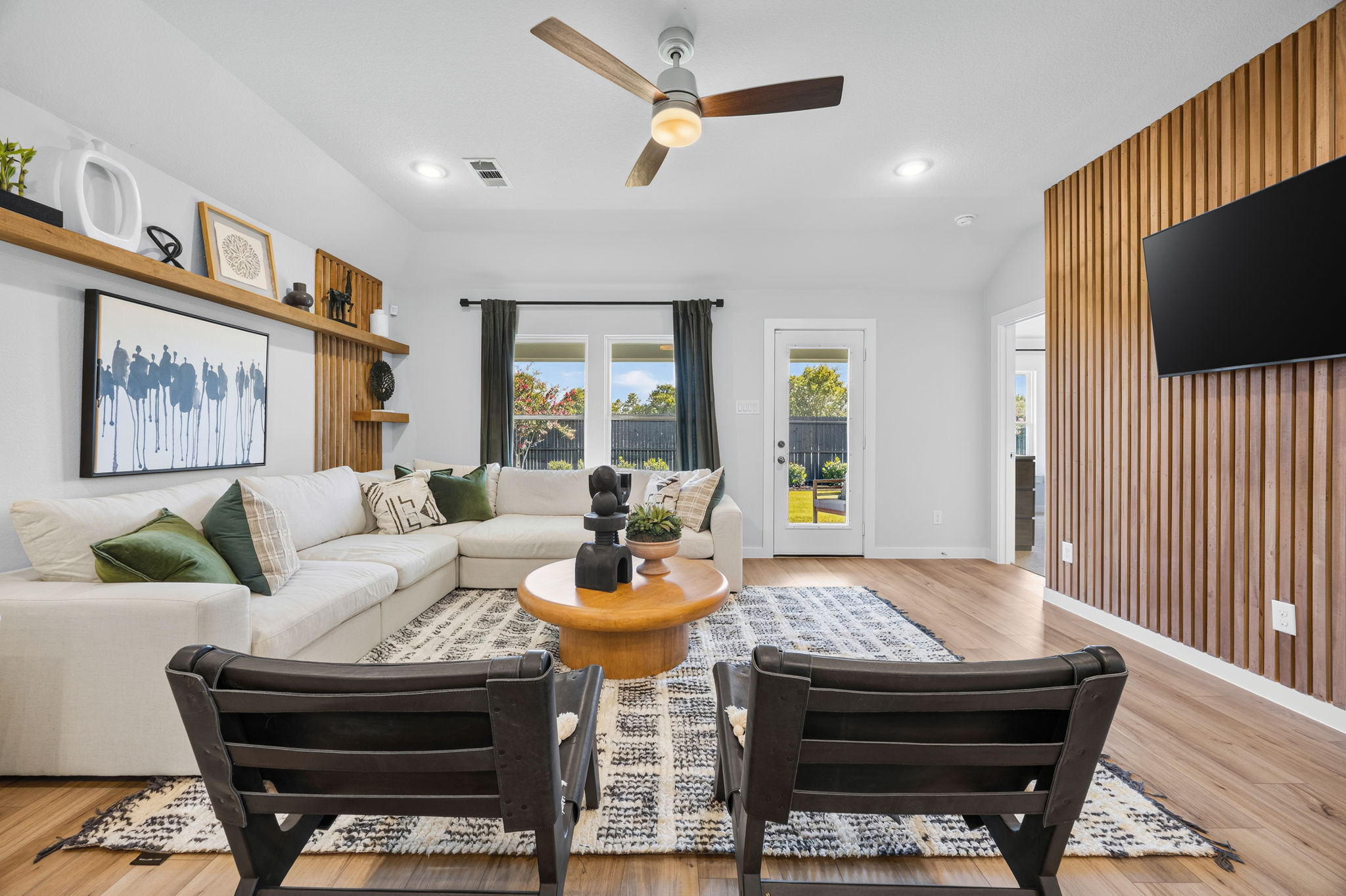 A living room with a large window.