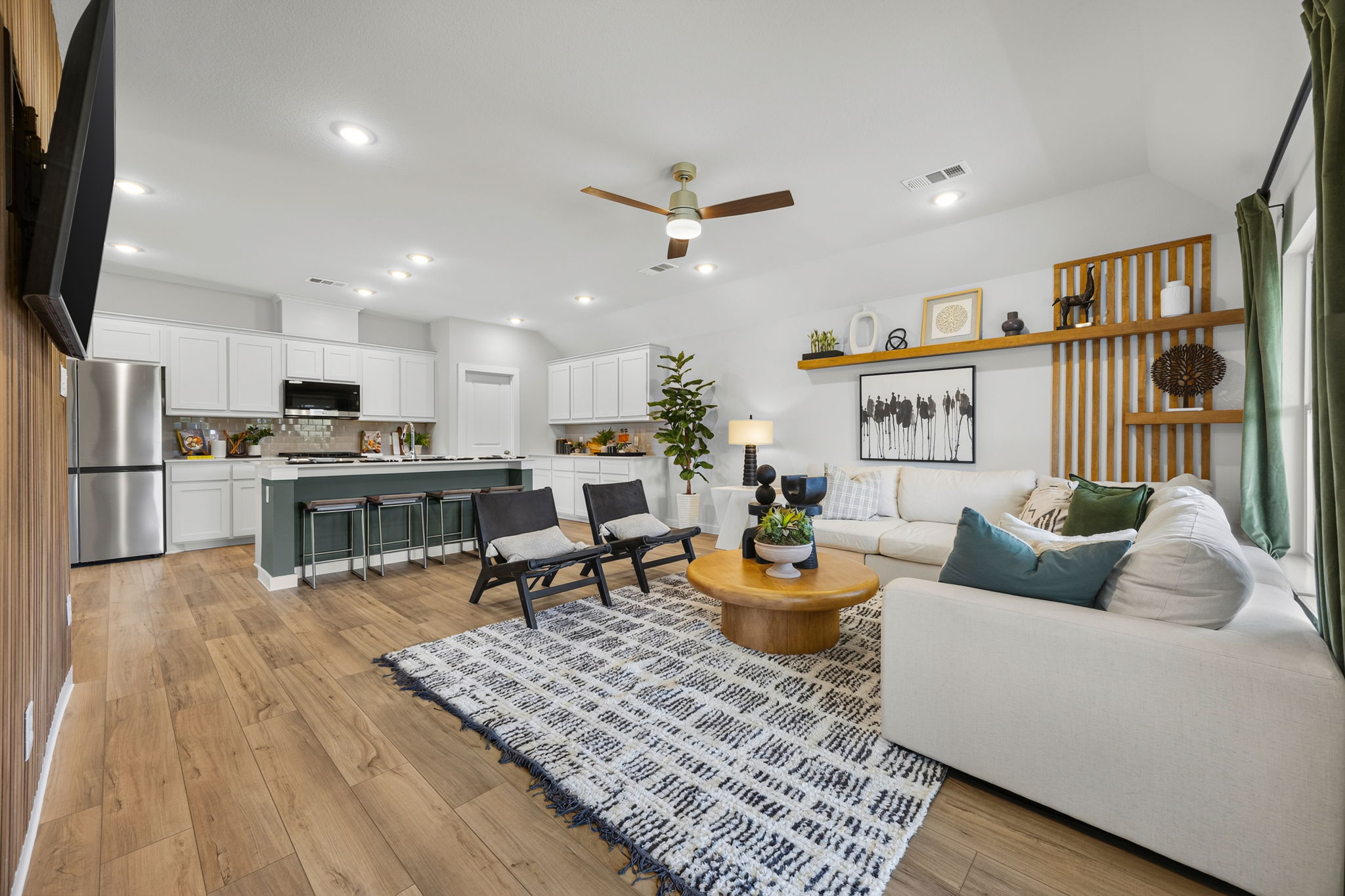 A living room with a wood floor.
