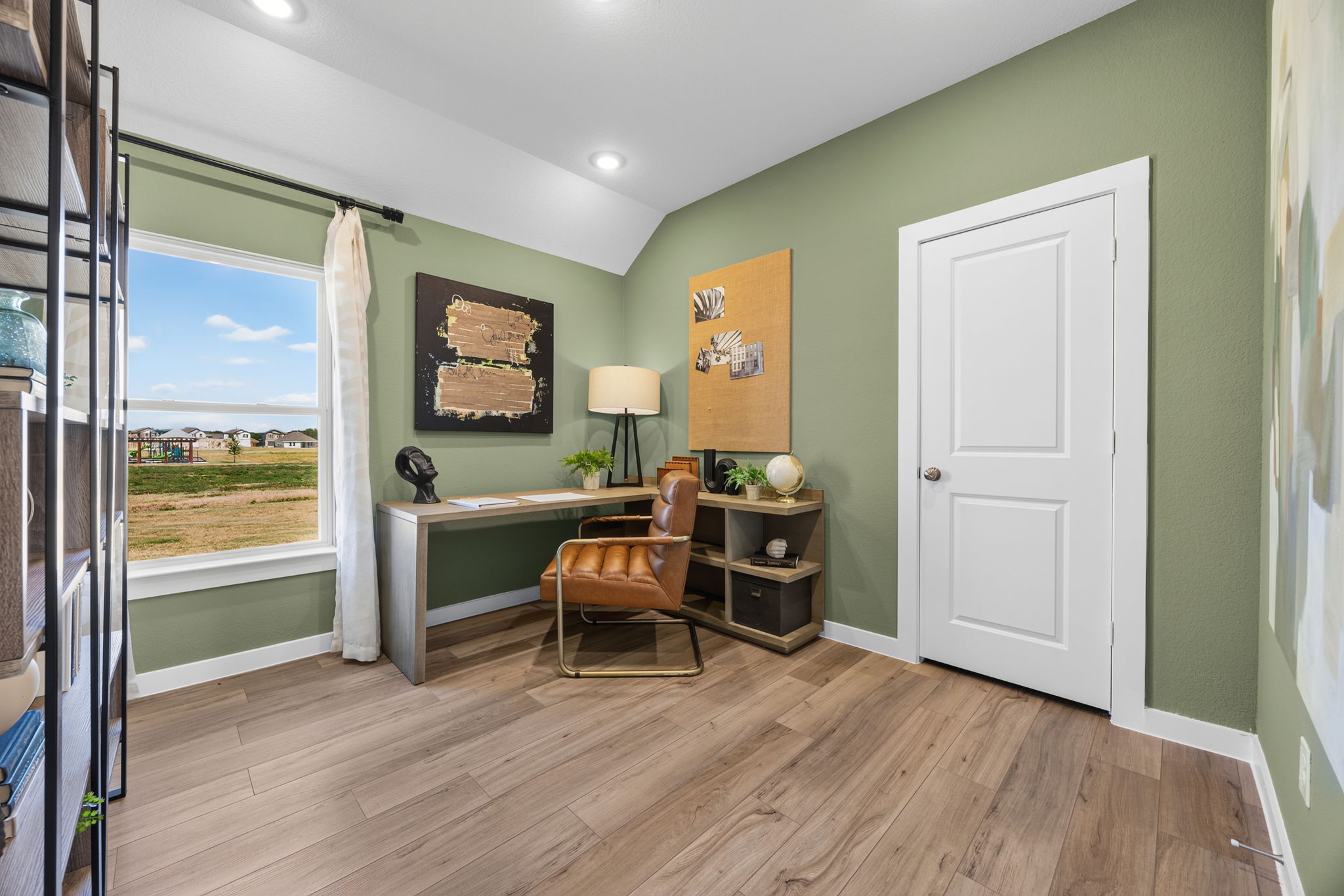 A room with a desk and a chair.